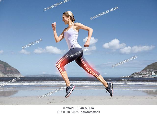 Highlighted leg bones of jogging woman on beach