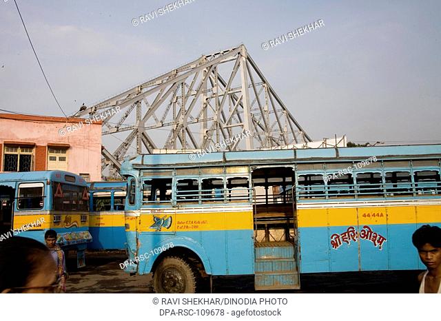 Street Scene ; View of Howrah Bridge now Rabindra Setu over River Hooghly ; Calcutta Kolkata ; West Bengal ; India