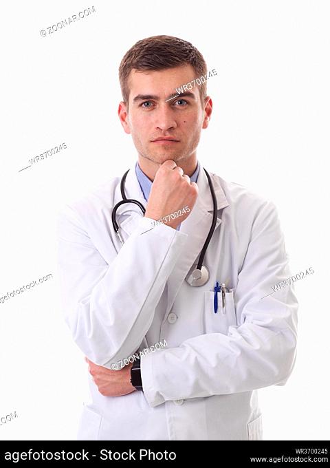 Portrait of hero in white coat. Cheerful smiling young doctor with stethoscope in medical hospital standing against white background
