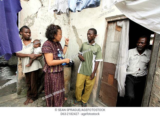 KENYA. American Catholic missionary visiting poor people with HIV AIDS, Mombasa