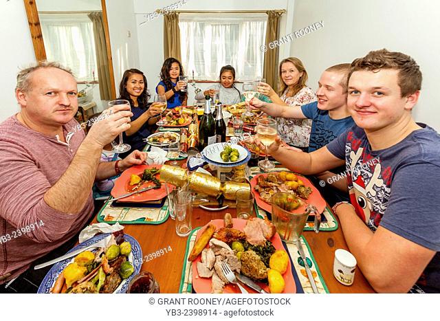 A Mixed Race Family Enjoying Christmas Lunch, Sussex, England