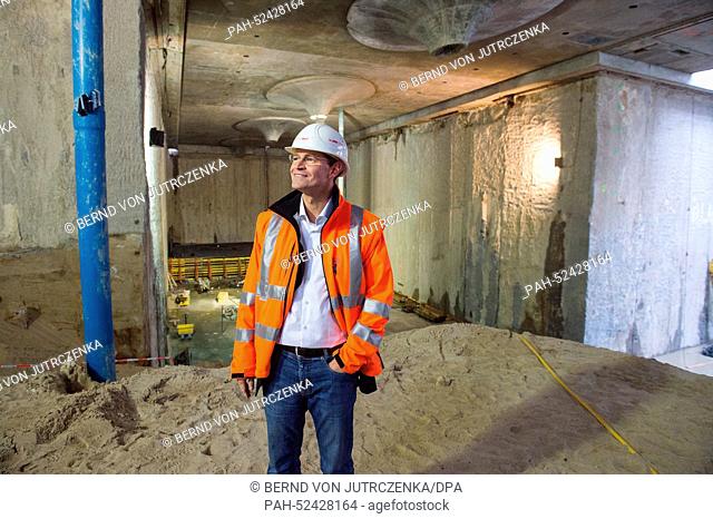 Berlin Senator of Urban Development Michael Mueller stand during a press opportunity at the construction site of subway line 5 at the 'Rotes Rathaus' in Berlin