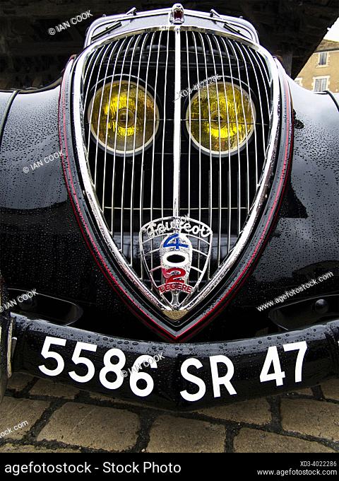 grill and headlights of Peugeot 402 (1935-1940) at classic car show, Villereal, Lot-et-Garonne Department, Nouvelle-Aquitaine, France