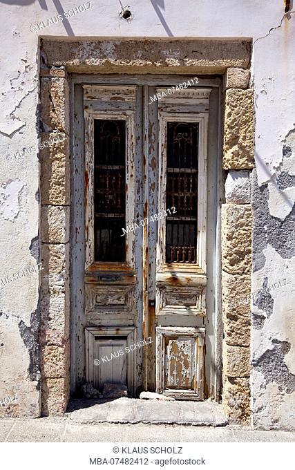 old dilapidated front door in Greece
