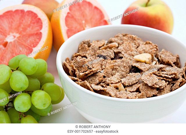 Healthy breakfast of bran flakes, pink grapefruit and grapes