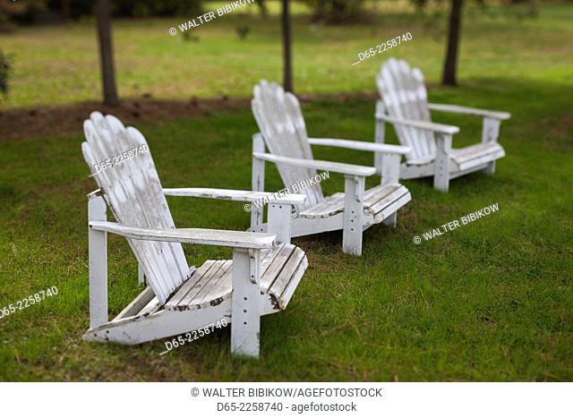 USA, North Carolina, Outer Banks National Seashore, Corolla, old Adirondack lawn chairs, defocussed