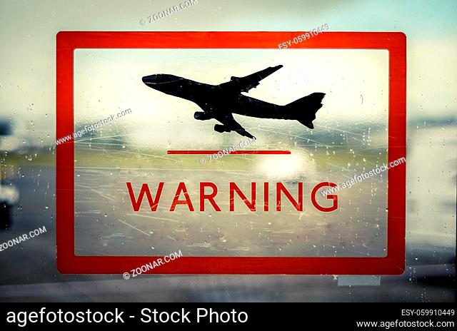 A Red Airport Warning Sign With Aircraft Taking-Off