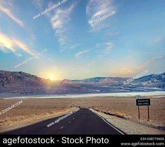 Desert road leading through Death Valley National Park, California USA