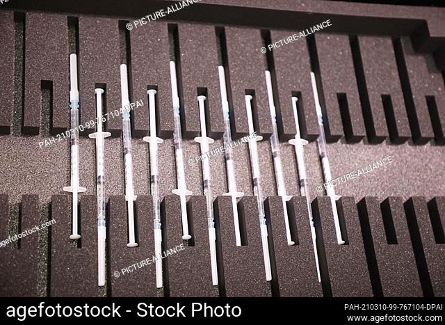 10 March 2021, Thuringia, Gera: Syringes with the AstraZeneca vaccine lie in a box at the opening of the supraregional vaccination centre in Gera