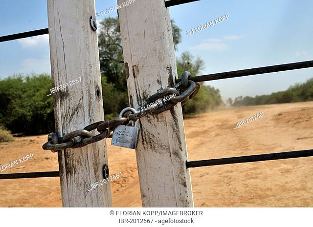 Locked gate, property owned by a big landowner, Gran Chaco region, Salta province, Argentina, South America