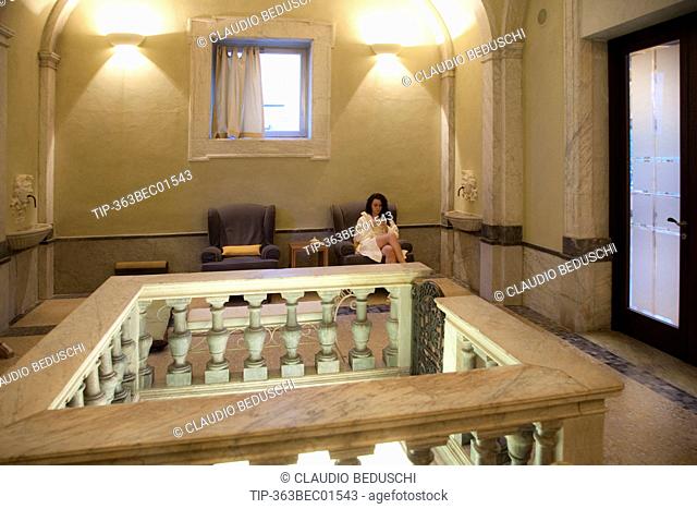 Italy, Tuscany, Bagni di Pisa, Terme San Giuliano spa, woman relaxing at spa