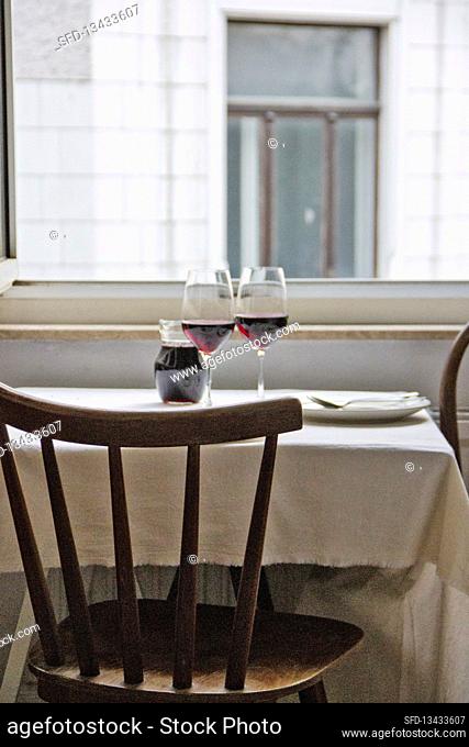 Laid table with red wine