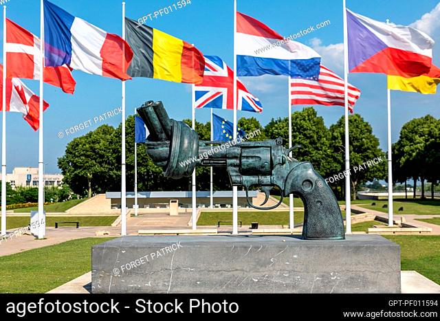 REVOLVER WITH A KNOTTED BARREL, SCULPTURE IN BRONZE 'NON-VIOLENCE' BY CARL REUTERSWARD, ESPLANADE OF THE MEMORIAL FOR PEACE, CAEN, CALVADOS, NORMANDY, FRANCE