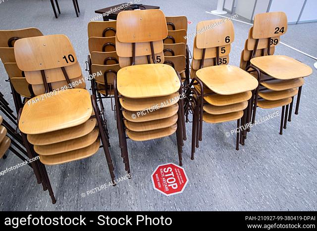 27 September 2021, Lower Saxony, Osnabrück: Chairs have been stacked up in the vaccination centre of the city of Osnabrück