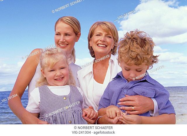 beach-scene, portrait, group picture, 3 generations, blond woman, 50 years, wearing white blouse, with her daughter, 25 years, and her 2 children, blond girl