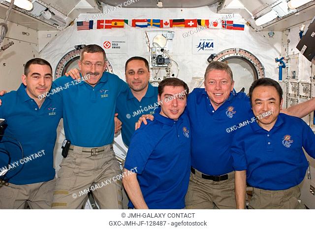 Expedition 2829 and Expedition 2930 crew members pose for a group portrait in the International Space Station's Kibo laboratory following the ceremony of...