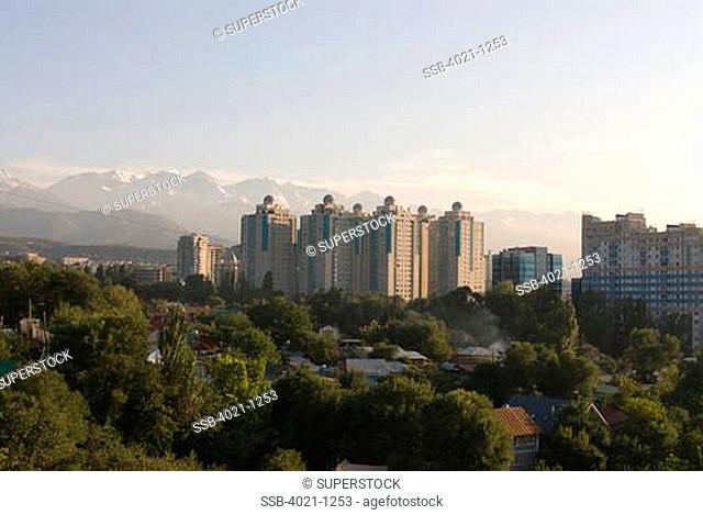 Kazakhstan, Almaty, Skyline with Altai Mountain Range in background