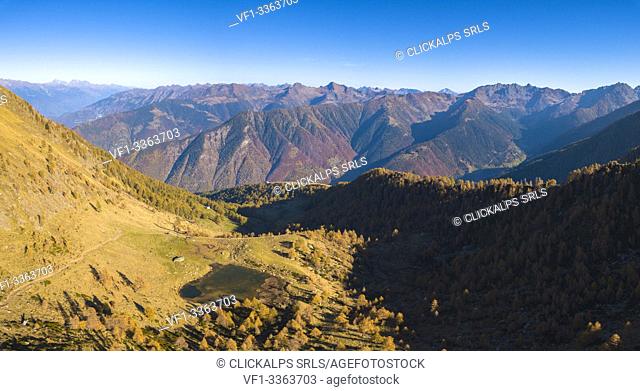Aerial panoramic of Lago di Culino and woods in autumn, Orobie Alps, Val Gerola, Valtellina, Sondrio province, Lombardy, Italy