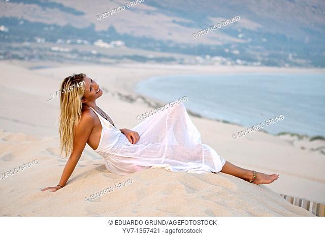 Sexy blonde woman lying on the beach