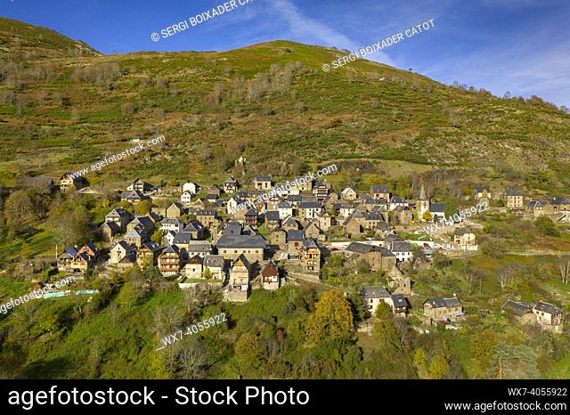 Aerial views of Bausen village and the surrounding forests in autumn (Aran Valley, Catalonia, Spain, Pyrenees)