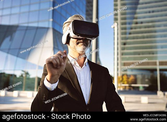 Businessman wearing virtual reality headset