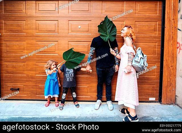 Family having fun on the street, posing on camera