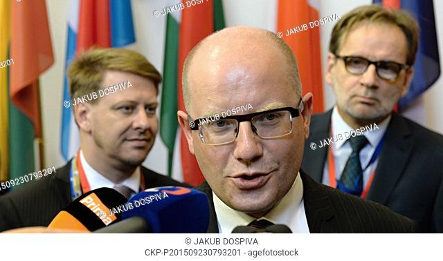 Czech Prime Minister Bohuslav Sobotka (centre) with media as he arrives for an emergency EU summit on the migration in Brussels, Belgium, September 23, 2015