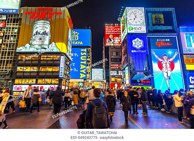 OSAKA, JAPAN - FEB 15, 2018 : Tourist walking in night shopping street at Dotonbori in Osaka, Japan on February 15, 2018