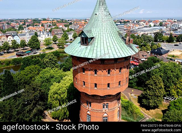 PRODUCTION - 22 June 2023, Lower Saxony, Cuxhaven: The historic water tower is located in the city center (aerial view by drone)