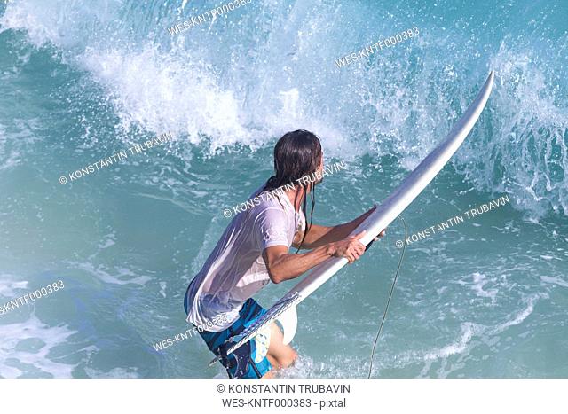 Indonesia, Bali, Surfer in front of a wave