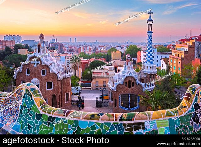 Barcelona city view from Guell Park with colorful mosaic buildings in tourist attraction Park Guell in the morning on sunrise, Barcelona, Spain, Europe