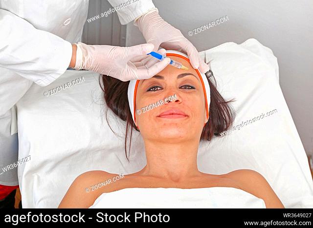 Young Woman Having Fillers Injection For Forehead Lines