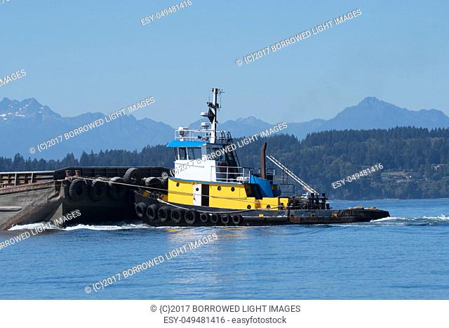 Wasp pushing gravel barge through Shilshole Bay on its way to Tacoma