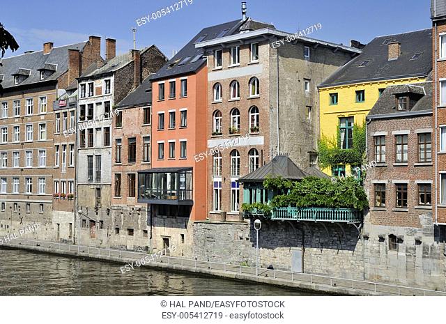 houses on sambre river, namur. foreshortening of old typical facades on river bank, shot in bright summer light