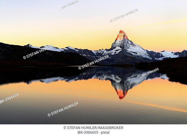 Matterhorn reflected in lake Stellisee, at sunrise, Valais Alps, Canton of Valais, Zermatt, Switzerland