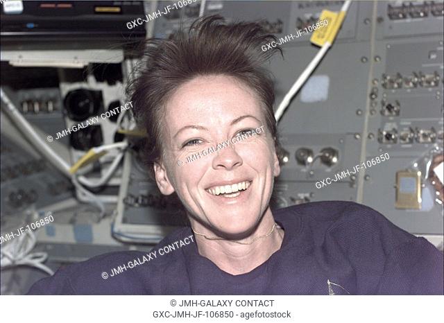 Astronaut Janet L. Kavandi, mission specialist, appears to enjoy her Red Team duties on Endeavour's flight deck
