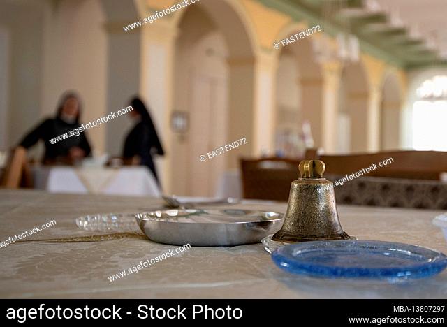 Germany, Saxony-Anhalt, Halle, table bells in the monastery, behind it two nuns, order of Saint Elisabeth
