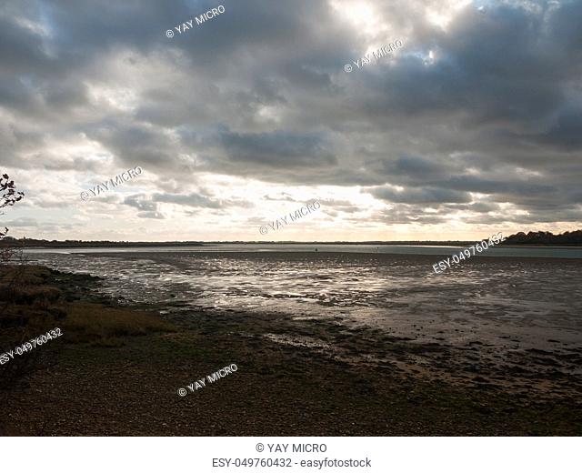 stunning dramatic cloud sky over estuary lake river ocean coastline landscape; essex; england; uk