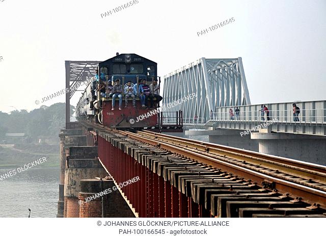 Old and new railway bridge with train in Ghorashal near Narsingdi on 09.01.2015 - Bangladesh | usage worldwide. - Ghorashal/Dhaka/Bangladesh