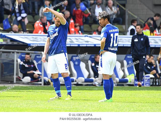 Karlsruhe's Erwin Hoffer (L) And Hiroki Yamada stand defeated after the 2. German Bundesliga soccer match between Karlsruher SC and 1