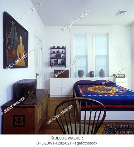 BEDROOMS - Primitive painting, painted folk art chest, contemporary unitized bed and night stands, colorful quilt, antique pottery jugs