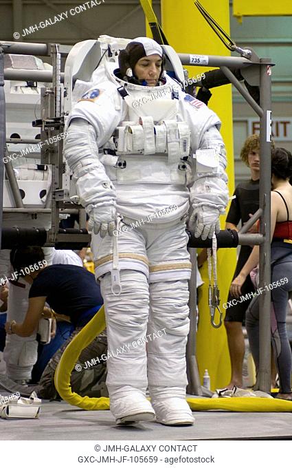 Astronaut Heidemarie M. Stefanyshyn-Piper, STS-115 mission specialist, attired in a training version of the Extravehicular Mobility Unit (EMU) space suit
