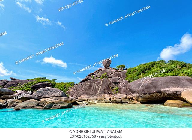 Beautiful landscape people on rock is a symbol of Similan Islands, blue sky and cloud over the sea during summer at Mu Ko Similan National Park