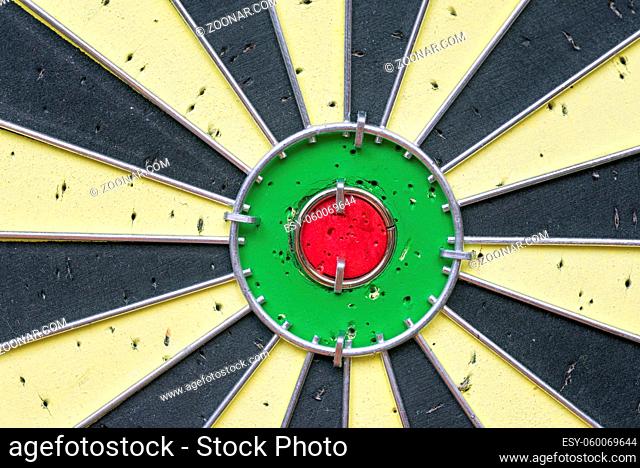 darts target closeup fragment with many holes