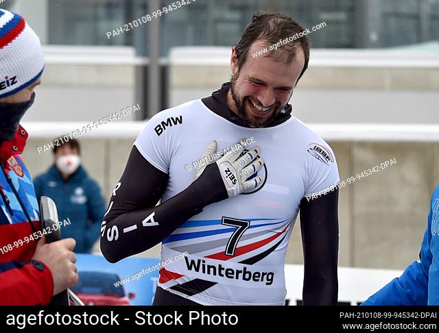 08 January 2021, North Rhine-Westphalia, Winterberg: Skeleton: World Cup men, 2nd run: Alexander Tretiakov from Russia cheers about his first place