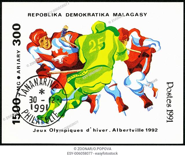 MALAGASY REPUBLIC - 1991: shows Three hockey players, 1992 Winter Olympics, Albertville