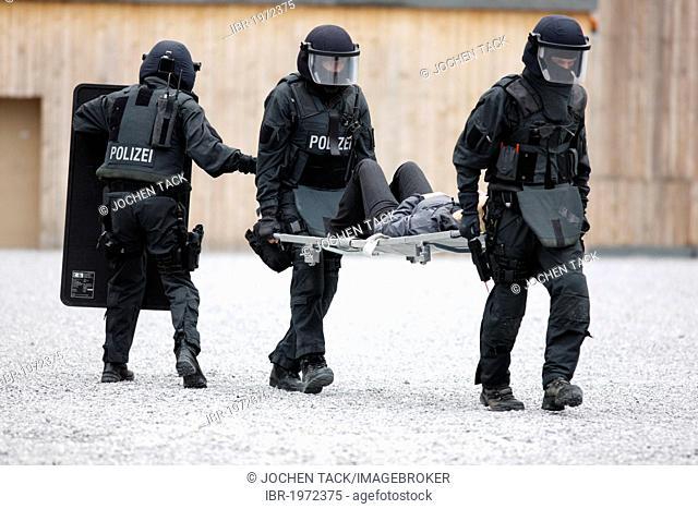 SEK or special response unit evacuating an injured hostage during an excercise, training center for special response units of the North Rhine-Westphalia state...