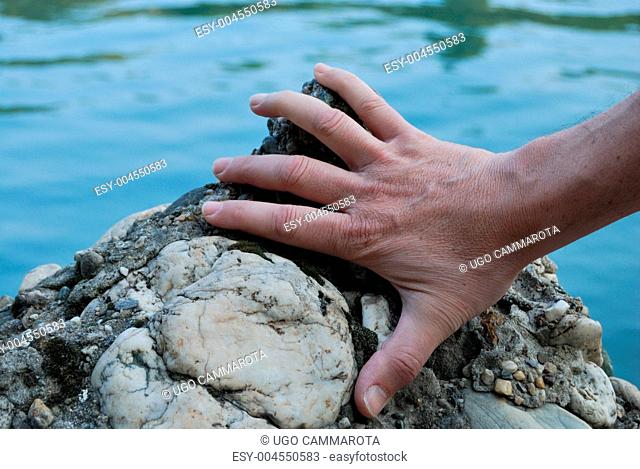 Hand on the rock
