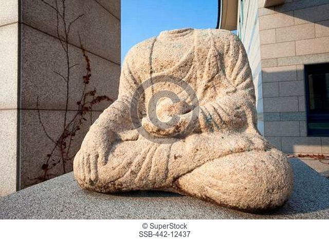 Headless stone statue of Buddha in a museum, Gyeongju National Museum, Gyeongju, South Korea