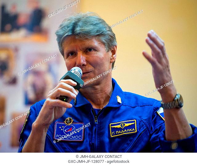 Quarantined Expedition 31 Soyuz Commander Gennady Padalka answers reporters questions from behind glass during a prelaunch press conference held at the...